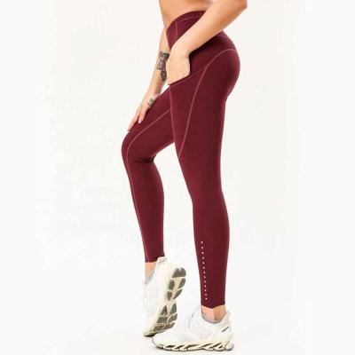 China Antibacterial Custom High Waisted Workout Gym Wear Yoga Fitness Leggings Seamless Compression Tight With Pocket Wholesale Yoga Pants for sale