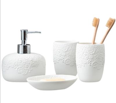 China Viable Luxury Ceramic White Lace Bathroom Accessories Hotel Quality Home Hotel Toilet Set of Four Piece Bath Set Bathroom Accessories for sale