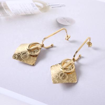 China FASHIONABLE hot sale European long fringe titanium steel luxury rose gold letter d earring for sale