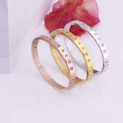 China Custom Fashion Slim Logo Bangle Metal Stainless Steel Free Engraving Bracelet for sale