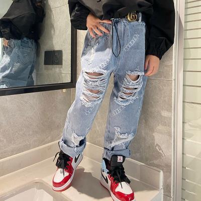 China Color Fade Proof Kids Girls Ripped Jeans 2021 New Loose Big Children Letter Printing Denim Pants for sale