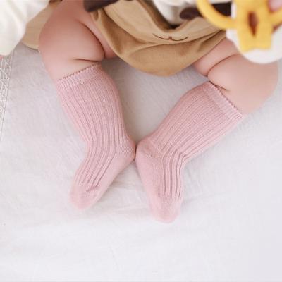 China Breathable Cute Long-tube Kids Socks Comfortable Cotton Cute Boys Socks Combed plain colorful Newborn Kid Socks for sale