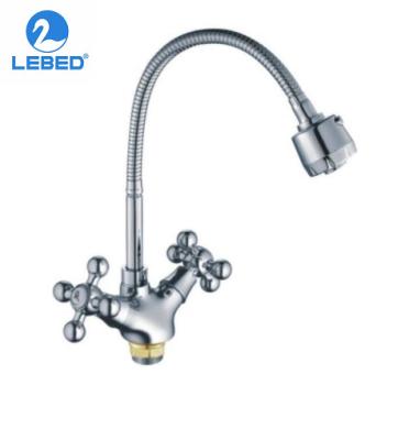 China Metered Taps European Style Kitchen Sink Mixer Tap Ceramic Double Handle 360 ​​Degree Swivel Brass Kitchen Faucet for sale