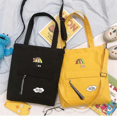 China Lightweight Canvas Tote Bags with Custom Printed Long Strap Purse Cartoon Logo Printing Messenger Bags for Women for sale