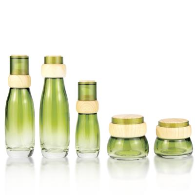 China Personal Care Bottle Set 50g 40ml 100ml Cosmetic Glass Spray Pump Bottle With Bamboo Wooden Cap for sale