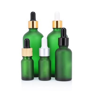 China Personal care empty 15ml 30ml 50ml frosted green glass essential oil dropper bottle for cosmetic packaging for sale