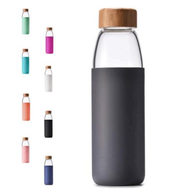 China Hot Selling Feiyou Amazon Glass Water Bottle Popular Home Outdoor Viable Coffee Tea With Bamboo Lid And Silicone Cup Set for sale