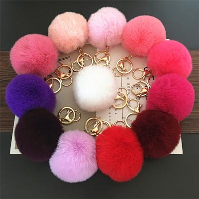 China Custom Fur Ball Tassel Fasion Plush Jewelry Accessories Rex Rabbit Fur Keychain With Bag Decoration Key Chain Pendant for sale