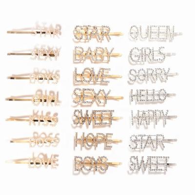 China Sweet Hair Accessories Fashion Mounted Gold Hair Clip Accessories Crystal Letter Hair Pins for sale