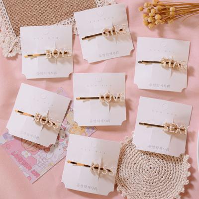 China Letter One Word Clip Love Boss Single Simple Star Kiss Gire Boys Combine Hair To Cut Pearl Female Hair Clip for sale