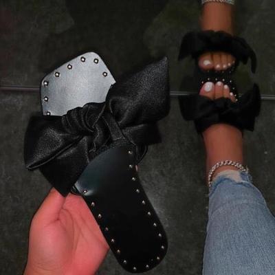 China Fashion trend flat slippers for women summer best fashion beach slippers ribbon bow women outdoor casual oversized sale flat bottom for sale