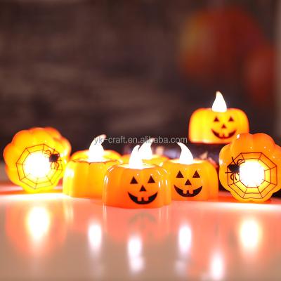 China Hot Selling Pumpkin Plastic Mini Lamp Halloween Festival Party Trick Props Led Pumpkin Candle Spider Led Lamp With Button Battery for sale