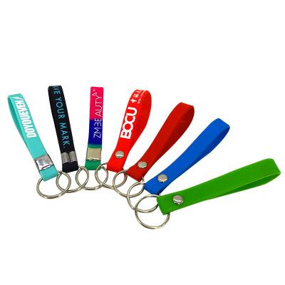 China Events Logo Promotional Silicone Wristband Keychains Custom Advertising Rubber Wristband Key Chain With Keychain Strap With Text for sale