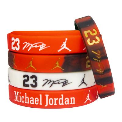 China Other Custom Cheaper Basketball Camouflage Print Debossed Rubber Festival Shopping Sport Wristband Wrist Band Silicone Wristband With Logo for sale