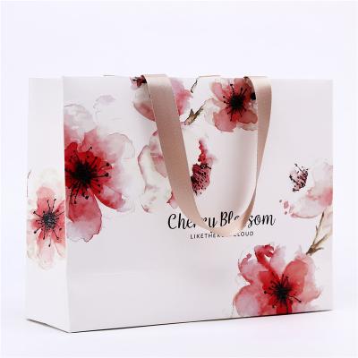 China Cheap Recyclable Lipack Women Loved Luxury Paper Bags Shopping Paper Bag Custom Printing With Handle for sale