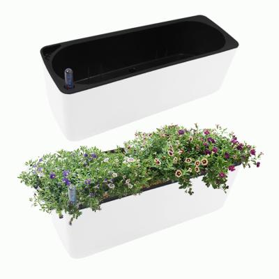 China Large New Design White Minimalist Outdoor Tall Planters Flower Pots Self Watering Pots for sale