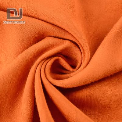 China Sustainable Made-to-Order Orange Dobby Striping Viscous Flowers Jacquard Fabric For Dresses for sale