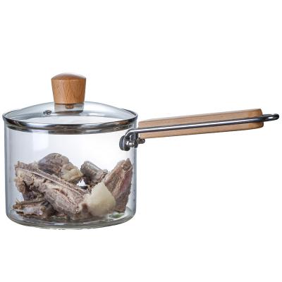 China Stocked 1200ml 2000ml Soup Glass Jar Heat Resistant Glass Cooking Pot With Wooden Handles for sale