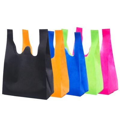 China Reusable Fashion Printing D W Cut Out Bag Non Woven Promotional Cheap Non Woven T Shirt Shopping Bag for sale