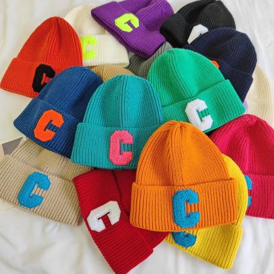 China YouYe COMMON 2022 Winter Candy Color Letter C Label Knit Beanie Hat High Quality Warm Knitted Hats For Women Kids for sale