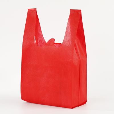 China Eco-friendly Reusable Grocery Non Woven Fabric PP Cheap Promotional T-shit Bag Non Woven Shopping Bags for sale