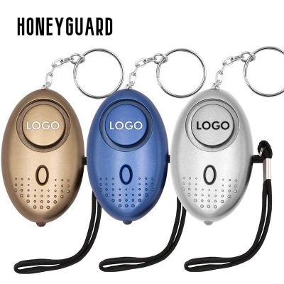 China Manufacturer Wholesale Multi Color Security Shield HONEYGUARD LED Lights Personal Security 130dB Key Chain Sound Alarm For Women for sale