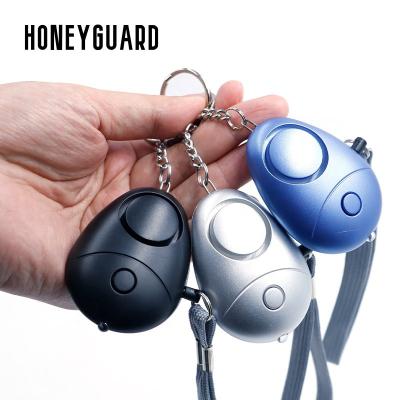 China Manufacturer Wholesale Multi Color Security Shield HONEYGUARD PA001 LED Lights 130dB Personal Security Shield Key Chain Sound Alarm for sale