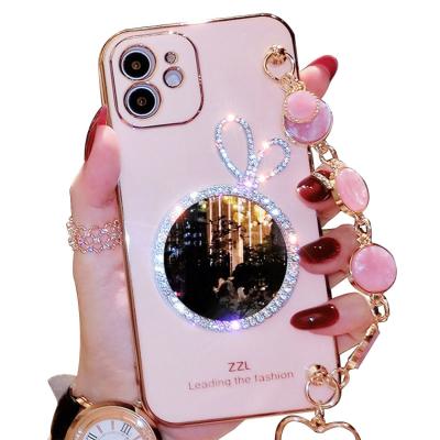 China Wholesale Fashion Wristband Rhinestone Makeup Mirror Shockproof Phone Case For Oppo Find X3pro for sale