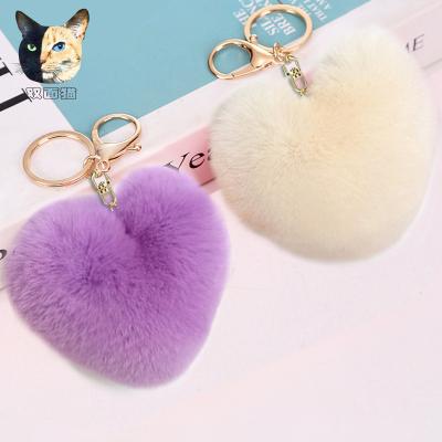 China Alloy 8 love hair ball word key chain peach heart plush car ornaments creative couples heart-shaped pendant manufacturers wholesale for sale