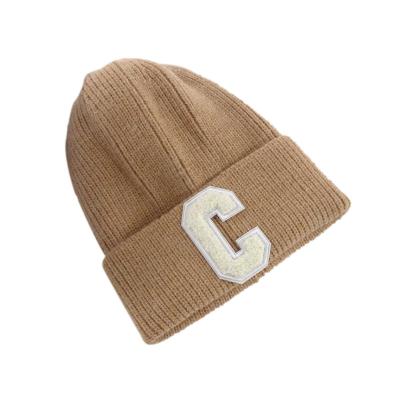 China JOINT Wholesale 100% Polyester Beanie Warm Knitted Hat Men Women Letter C Label Skull Cuff Beanies Winter for sale