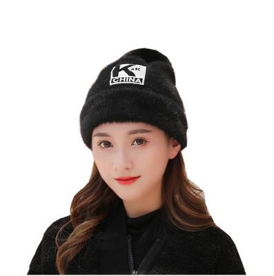 China COMMON Plush Slapped Polyester Beanie Streetwear Imprint On Body Beanies Hats With Pompom Winter Hat Warm Soft Wholesale for sale