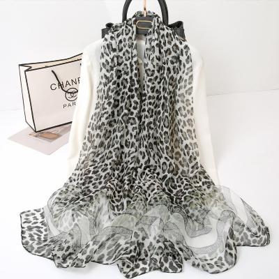 China Long shawl fashion decoration sunscreen new leopard print 2022 silk scarf European and American popular scarf for sale