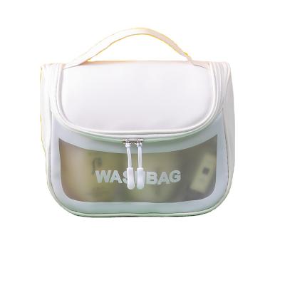 China Cubic Square Customized logo holographic TPU transparent storage bag, luxurious makeup bag, hand in hand carrying bag for sale