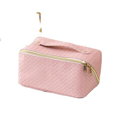 China Stereoscopic Square Grid Embossed High Capacity PU Leather Makeup Bag for Women's Travel Makeup Bag Wholesale Bathroom Storage Bag for sale