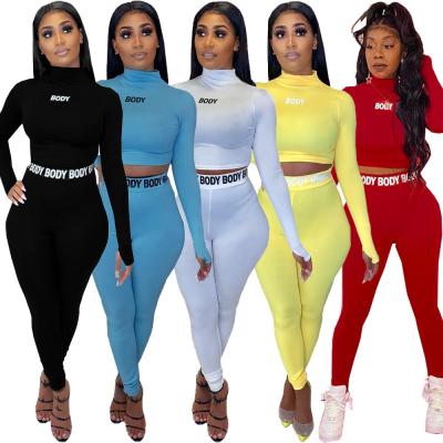 China QUICK DRY sports casual fashion shaping tight BODY letter printing tracksuit set two-piece set tracksuit women sweatsuit set for sale