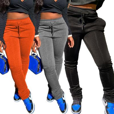 China Anti-Wrinkle Fashion Street Solid Color Drawstring Pockets Gaiters Sweatpants Womens Pants And Trousers for sale