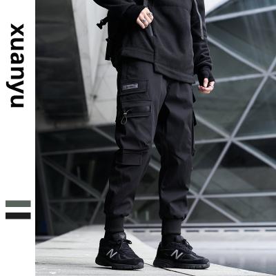 China QUICK DRY spring men's casual pants loose jumpsuits plus size belt fashionable brand men sports pants men for sale