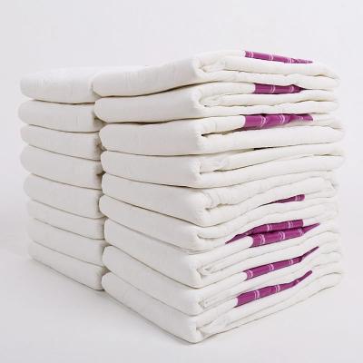 China Low Price OEM Embroidered Disposable Adult Diaper With High Absorbency Soft Outdoor Adult Diapers Bulk Adult Diaper Pants Factory for sale