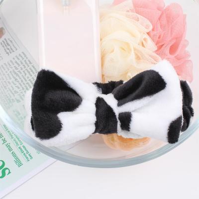 China Hot Selling Soft Cowhide And Leopard Coral Fleece Spa Hair Band Women Excellent Elasticity Bow Fluffy Bath Head Band for sale