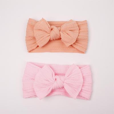 China New European and American custom makeup children's bow elastic solid color nylon baby turban hair band for sale