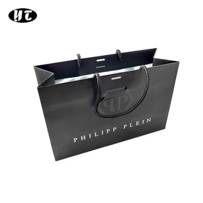 China New Logo Hot Foiled Stamping Black Matt Kraft Paper Bag With Gold Biodegradable Cotton Rope Handles for sale