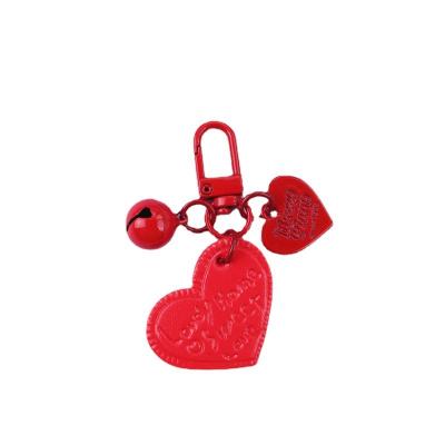 China Eco - Friendly Promotional Decoration Heart Bag Fashion Gift Leather Stock Key Chain for sale