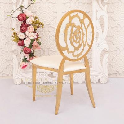 China Modern Stackable White PU Furniture Rose Pattern Back Banquet Hall Chairs For Wedding for sale