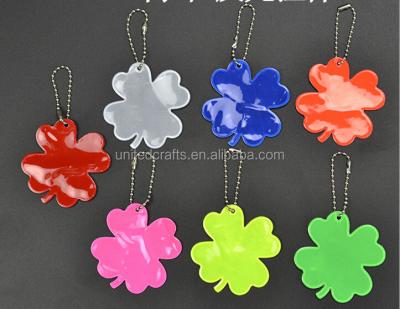 China Promotional Flower Shape Gift EN13356 Reflective Key Chain For Schoolbag Four Leaf Clover Reflective Pendant for sale