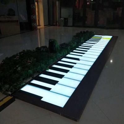 China Floor lighting when people step on and color change with music. 2021 Delicate LED Piano Interactive Dance Floor Dance Floor Tiles For Event Party Decoration for sale