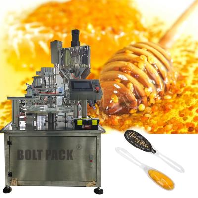 China Food Semi - Automatic Three Output Honey Spoon Sealing And Packaging Machine for sale