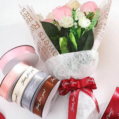 China Factory Custom Floral Glitter Logo Printed 2.5cm Metallic Ribbon Rolls for Decoration Packing Bouquets Wrapping Satin Ribbon Suppliers for sale