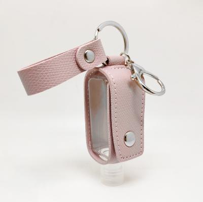 China Detachable Leather Hand Sanitizer Holder Hand Key Chain Lip Balm Container Lip Gloss Sanitizer Key Chain for sale