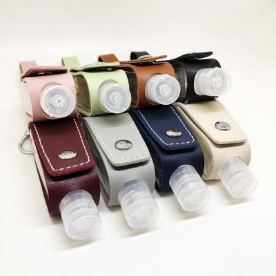 China 2021 Leather Hand Sanitizer Holder Leather Key Chain Lip Gloss Lip Sanitizer Container Key Chain for sale