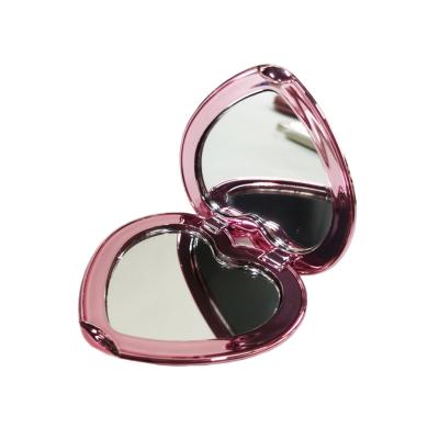 China Custom Portable Beautiful Folding Enlarging Handheld Heart Shape Mini Compact Pocket Mirror for sale